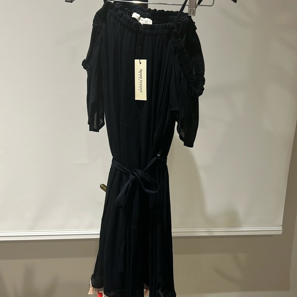 Black summer off shoulder dress with pompons detail on bottom of dress